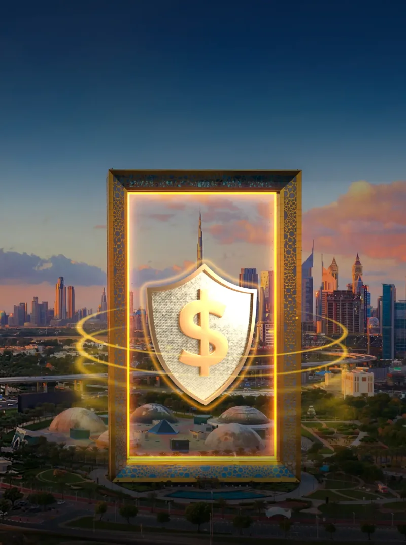 A digital illustration featuring the Dubai Frame at sunset, with a large glowing shield containing a dollar sign floating in its center, set against the Dubai city skyline.